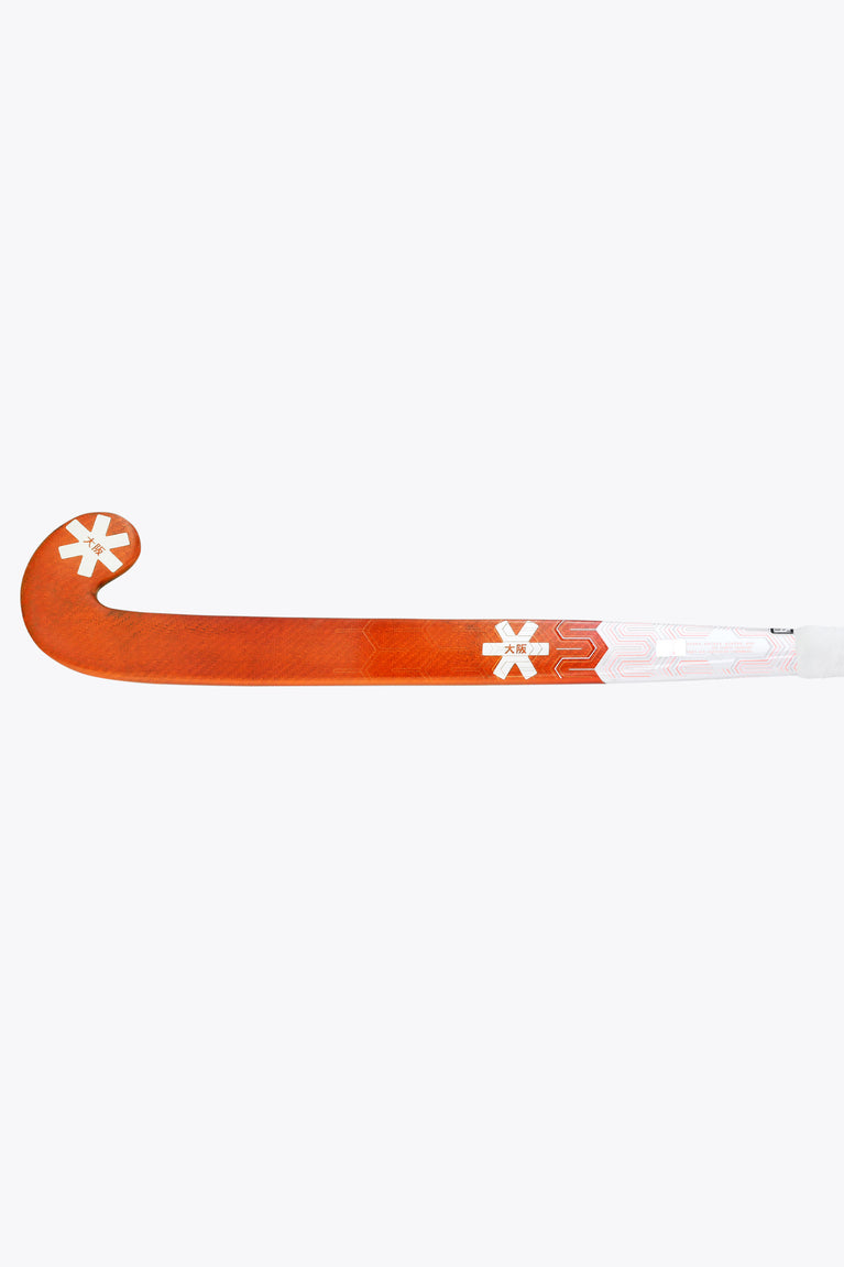 Orange-and-white field hockey stick with curved U-head and long shaft side view