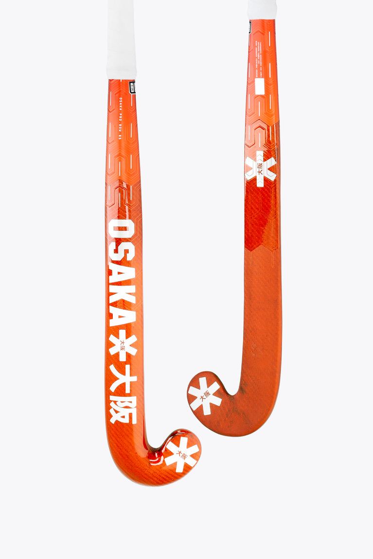 Bright orange field hockey stick with curved hook end and white accents