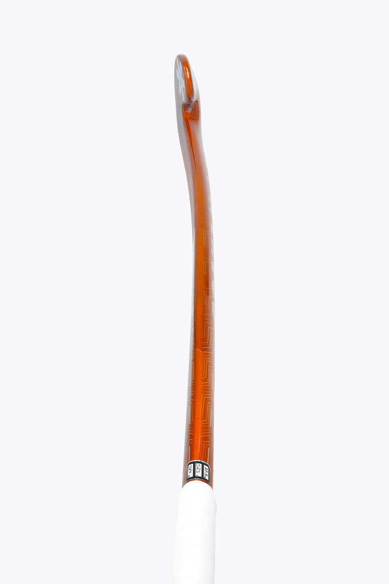 Bright orange field hockey stick shaft with white end cap and grip