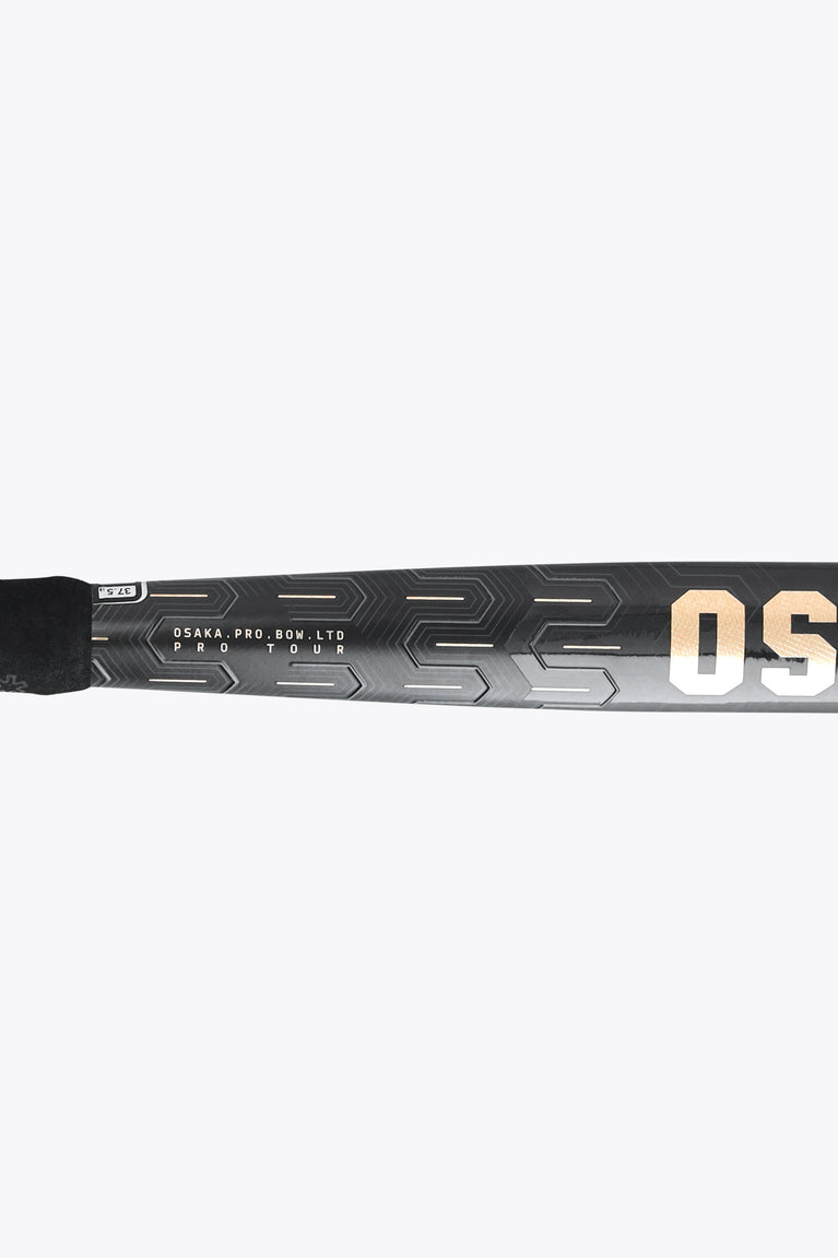 Field hockey stick shaft close-up with gold lettering and geometric pattern