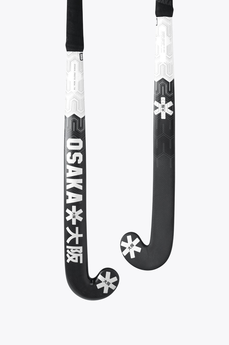 Field hockey stick blade with Osaka text and star logo on white and black