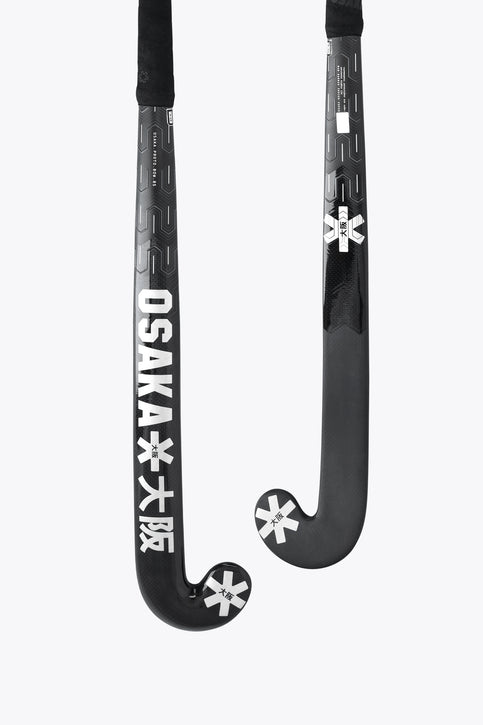 Dark field hockey stick with curved blade and star-style logos on the lower shaft