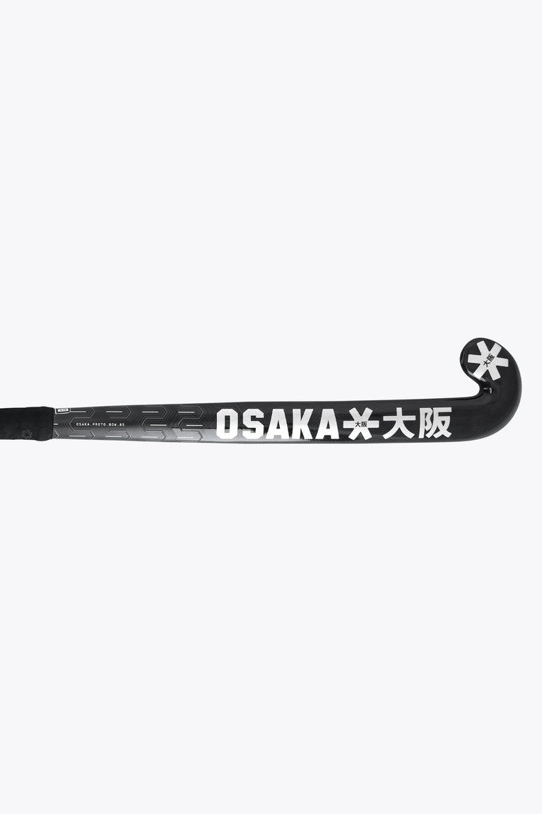 Dark field hockey stick shaft with “OSAKA” print and star logo at the top end