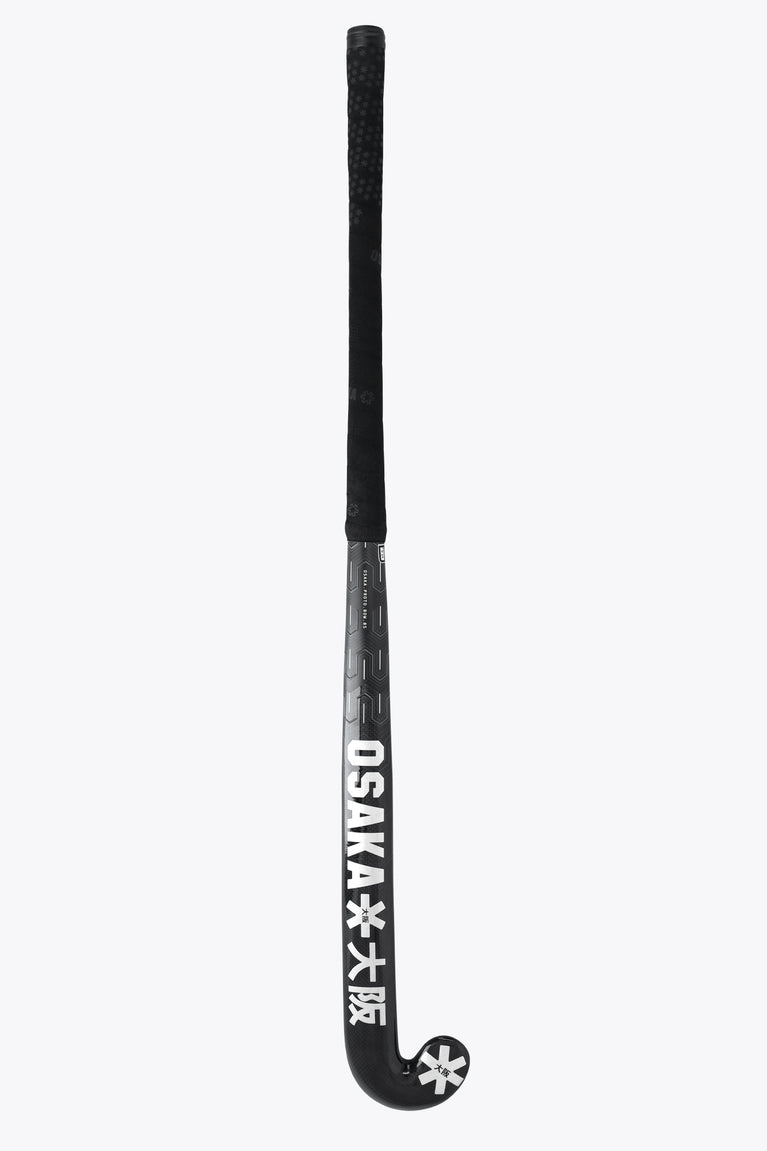 Dark field hockey stick with textured handle grip and “OSAKA” branding on the shaft