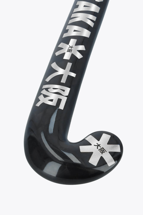 Field hockey stick head view, black blade with star marks and Osaka logo on shaft