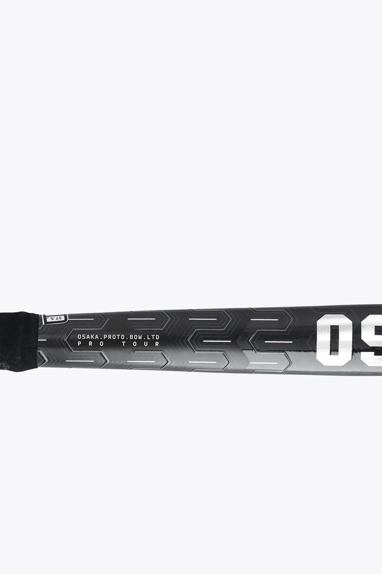 Field hockey stick shaft close-up, black with Osaka prototype text and geometric silver print