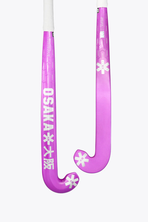 Purple low-bow field hockey stick showing curved blade and printed shaft