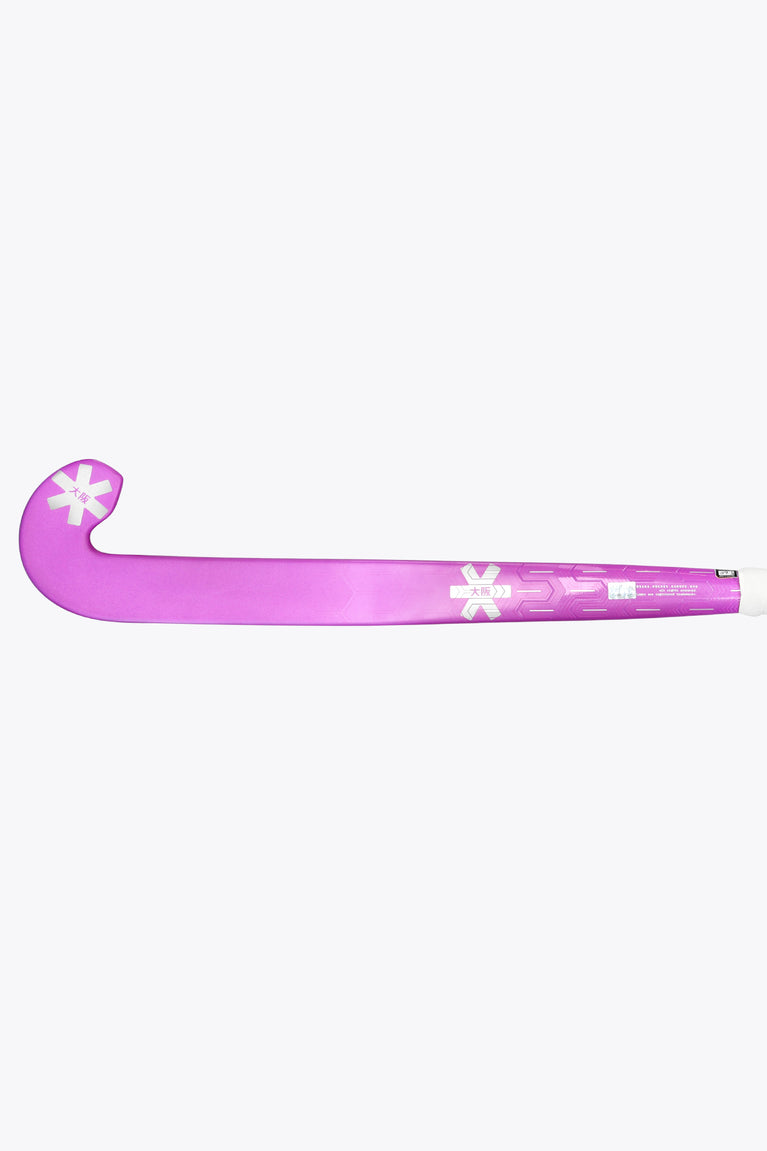Purple low-bow field hockey stick laid horizontally with printed shaft