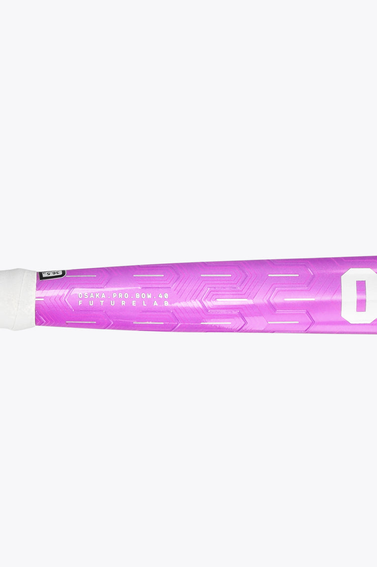 Purple field hockey stick showing handle area, grip, and patterned shaft