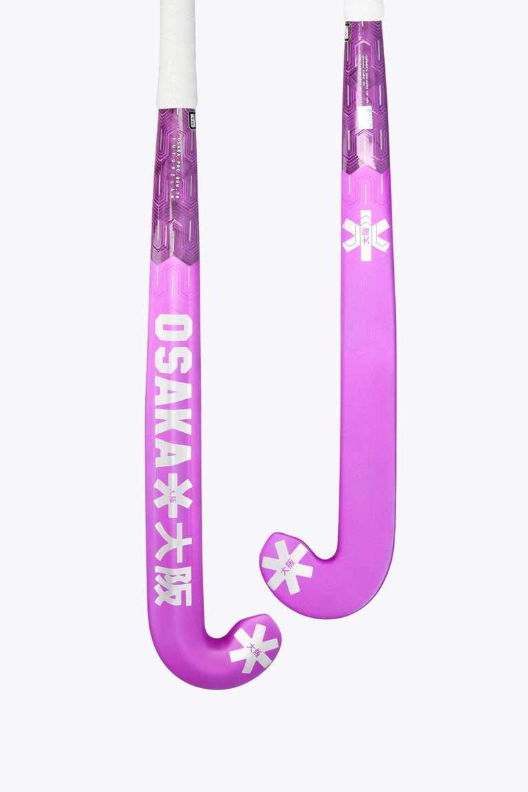 Purple low-bow field hockey stick head with rose bud graphics and white shaft.