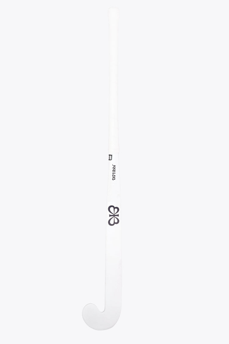 White field hockey stick shaft with small black label and black four-petal logo