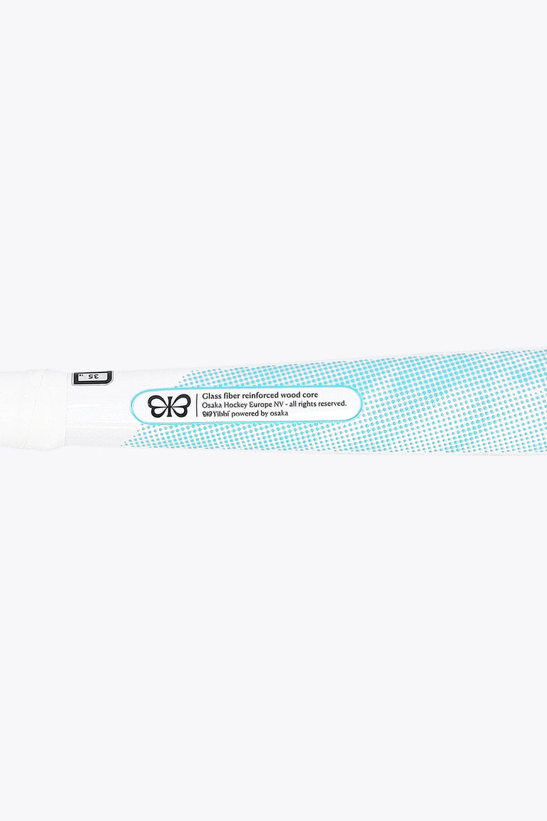 White field hockey stick with blue text label near the blade and black logo