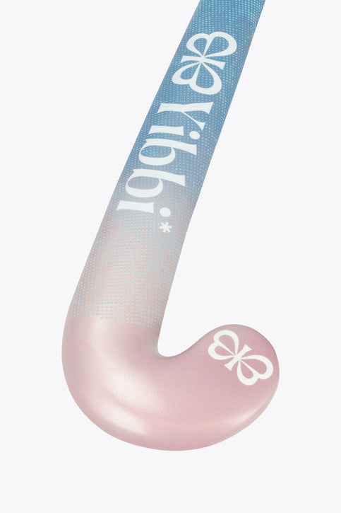 Mid-bow field hockey stick with blue-to-pastel pink shaft and rounded white blade.