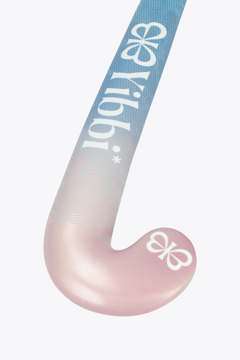 Mid-bow field hockey stick angled view, blue top fading to pastel pink blade.