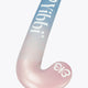 Mid-bow field hockey stick angled view, blue top fading to pastel pink blade.