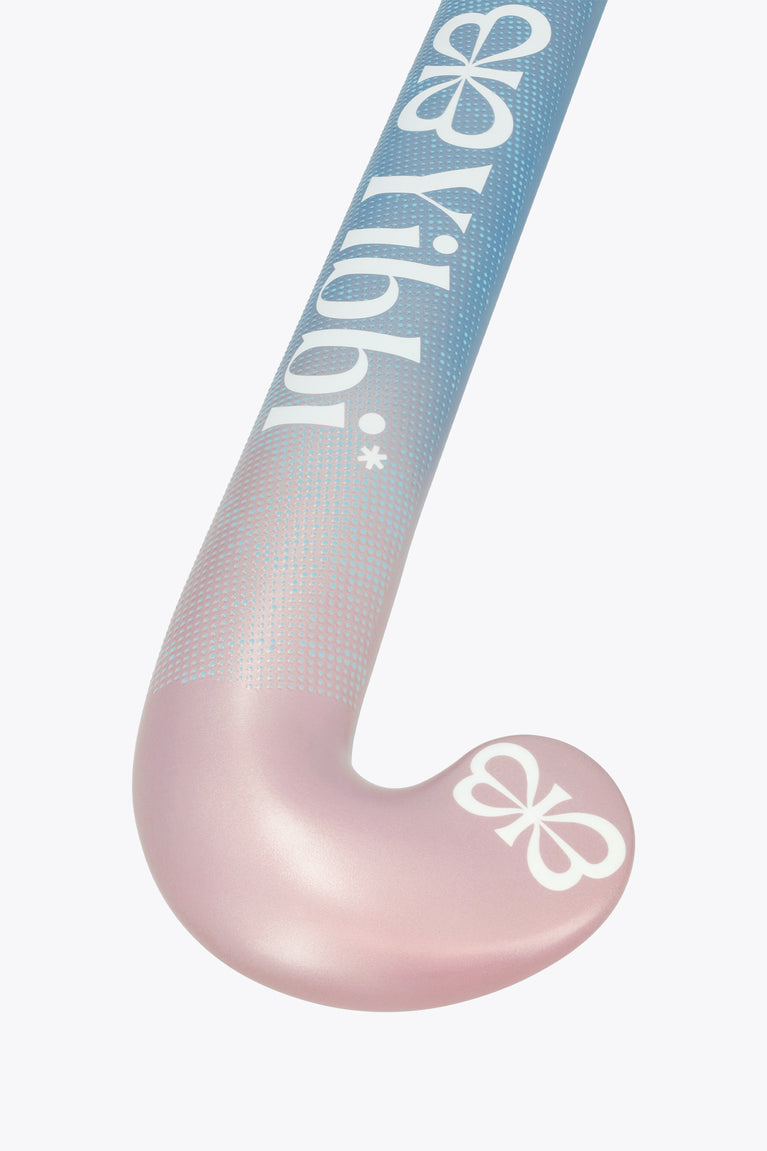 Mid-bow field hockey stick head with blue-to-pink gradient and clover grip