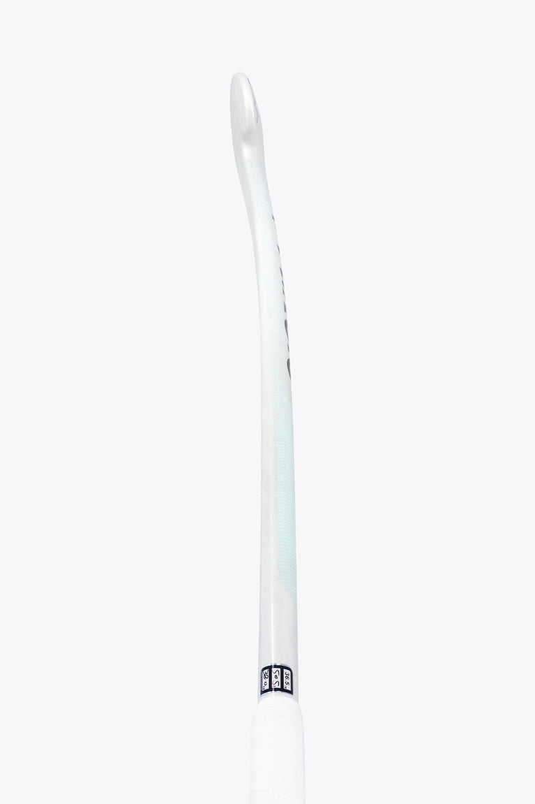 Field hockey stick shaft, white with small blue accent marks near the grip