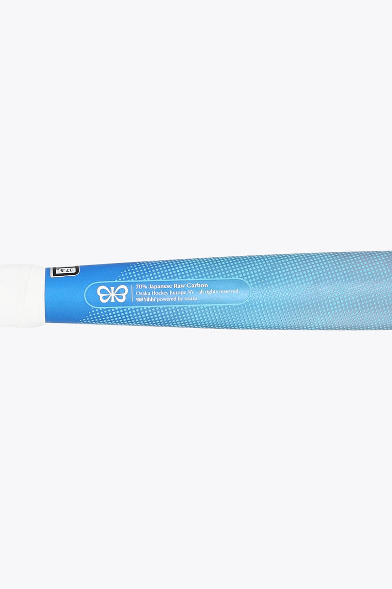 Field hockey stick shaft end with blue label and small icon graphics.