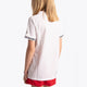 Girl wearing the Osaka Kids Jersey in white. Back view