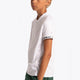 Boy wearing the Osaka Kids Jersey in white. Side view