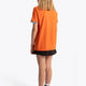 Girl wearing the Osaka Kids Jersey in Orange. Back view