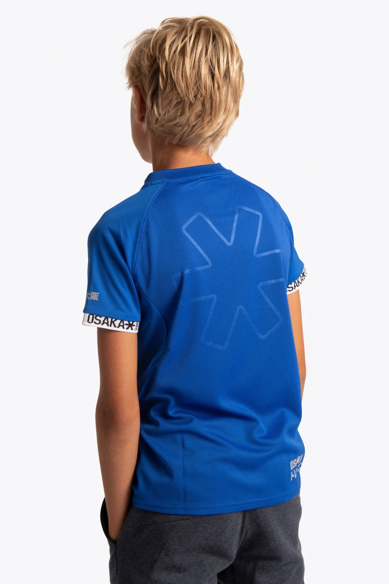 Boy wearing the Osaka Kids Jersey in Royal blue. Back view
