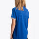 Girl wearing the Osaka Kids Jersey in Royal blue. Back view