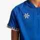 Boy wearing the Osaka Kids Jersey in Royal blue. Front detail logo view