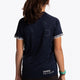 Girl wearing the Osaka Kids Jersey in Navy. Back view