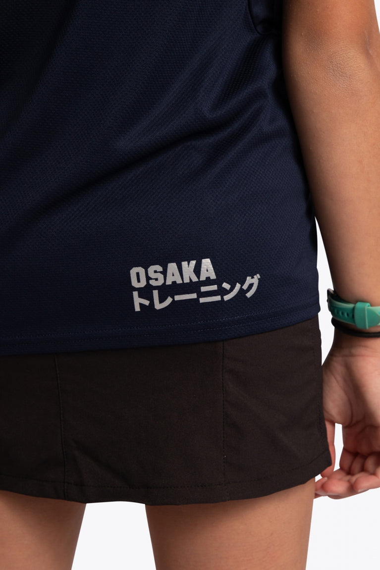 Model wearing the Osaka Kids Jersey in Navy. Back detail logo view
