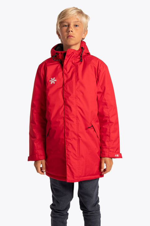 Boy wearing the Osaka Kids Stadium Jacket in Red. Front view