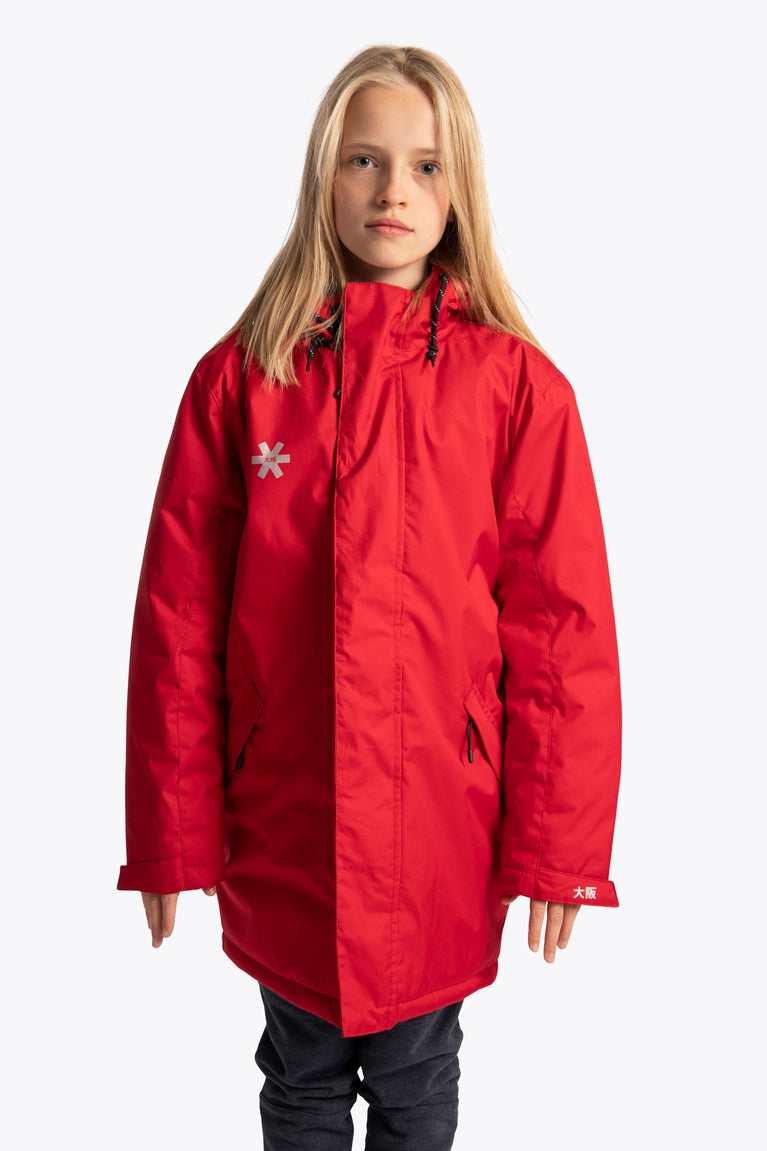 Girl wearing the Osaka Kids Stadium Jacket in Red. Front view