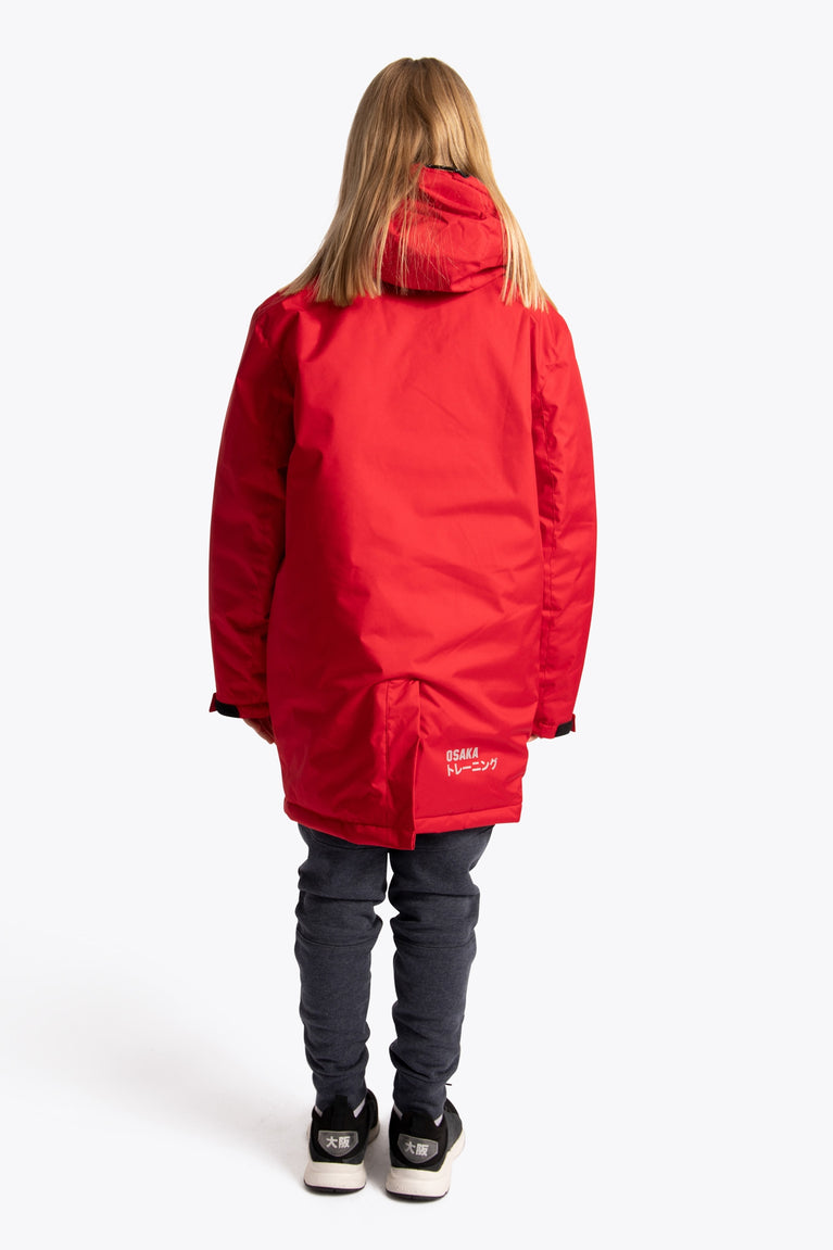 Girl wearing the Osaka Kids Stadium Jacket in Red. Back view
