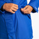 Boy wearing the Osaka Kids Stadium Jacket in Navy Blue. Front detail pocket view