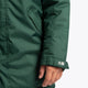 Boy wearing the Osaka Kids Stadium Jacket in Dark Green. Front detail sleeve view