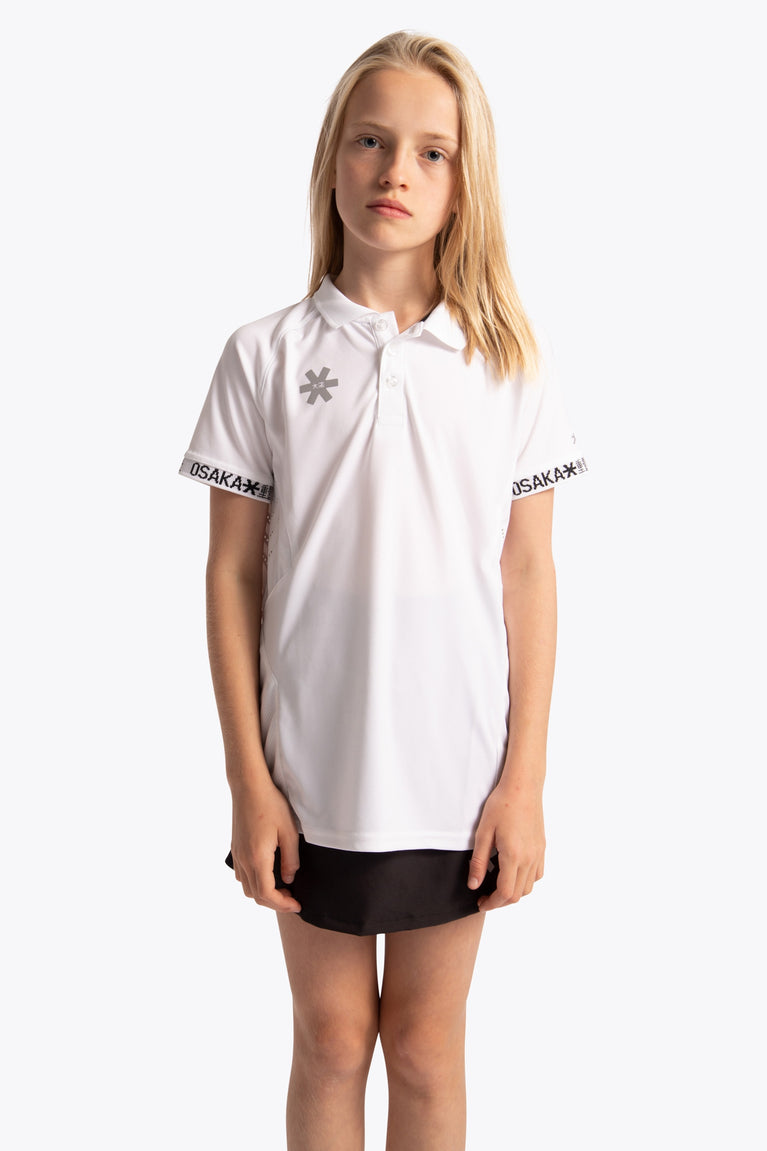 Girl wearing the Osaka Kids Polo Jersey in White. Front view