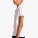 Boy wearing the Osaka Kids Polo Jersey in White. Side view