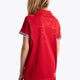 Girl wearing the Osaka Kids Polo Jersey in Red. Back view