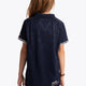Girl wearing the Osaka Kids Polo Jersey in Navy. Back view