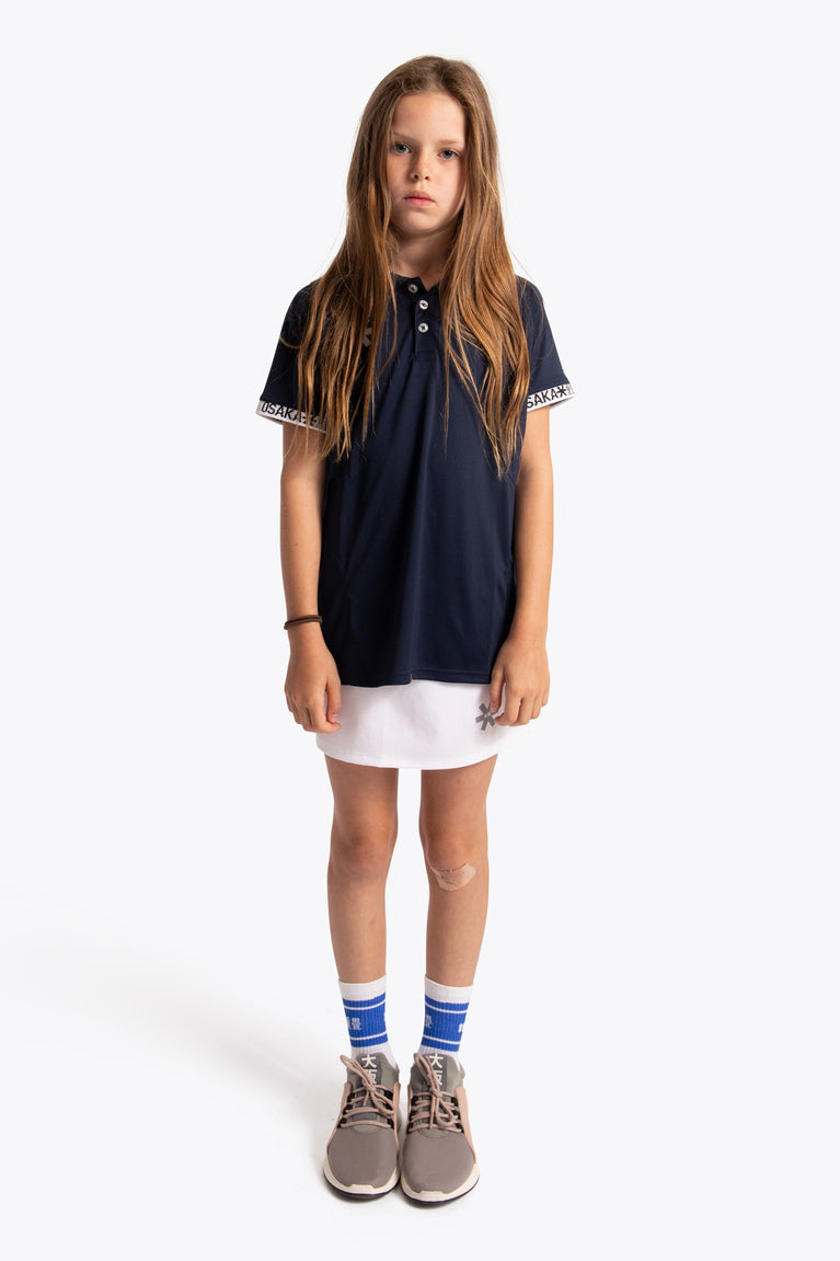 Girl wearing the Osaka Kids Polo Jersey in Navy. Front view