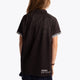 Girl wearing the Osaka Kids Polo Jersey in Black. Back view