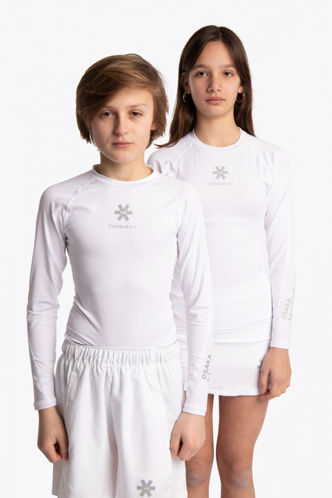 Boy and girl wearing the Osaka Kids Baselayer Top in white. Front view