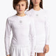Boy and girl wearing the Osaka Kids Baselayer Top in white. Front view