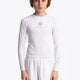 Boy wearing the Osaka Kids Baselayer Top in white. Front view