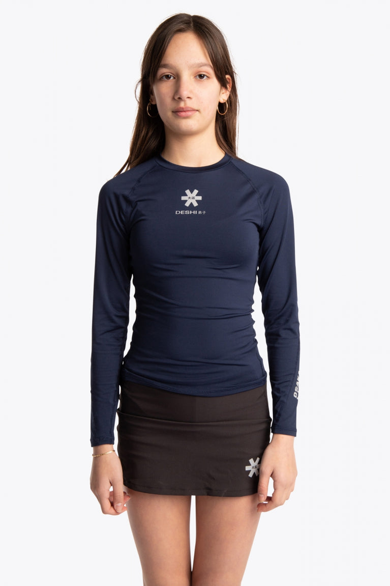  Girl wearing the Osaka Kids Baselayer Top in Navy. Front view