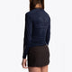 Girl wearing the Osaka Kids Baselayer Top in Navy. Back view