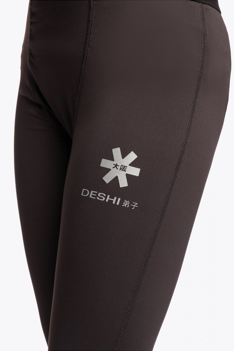 Model wearing the Osaka Kids Baselayer Tights in Black. Detail view