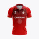 Red kids polo jersey with collar, button placket, front sponsor logos and team crest