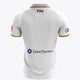 White men’s polo jersey, back view, geometric pattern with red and orange collar trim
