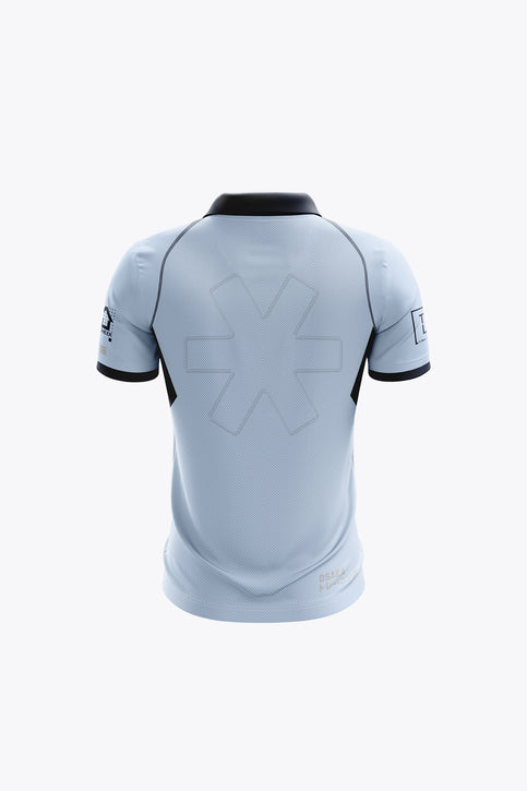 Kids sky blue polo jersey with black collar and trim, front button placket